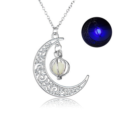 metal crescent moon with white pendent  