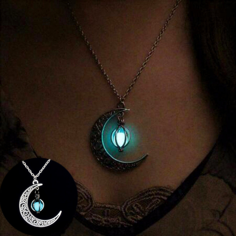 metal crescent moon with blue pendent  