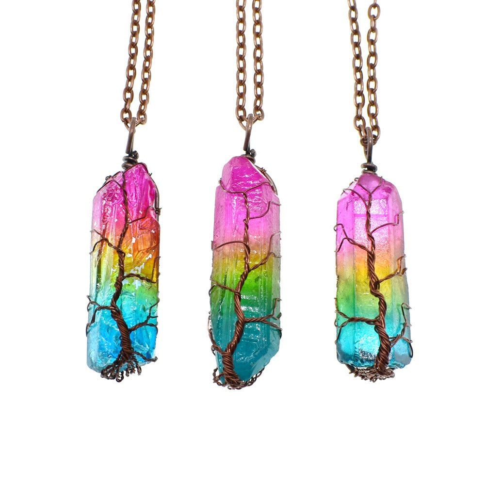 three multi colored crystals hanging from necklace