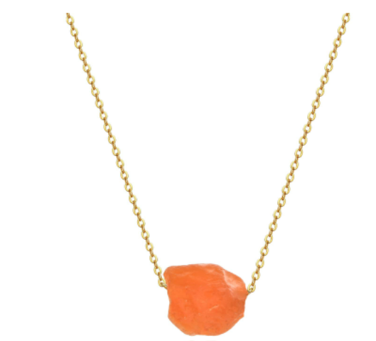 orange stone hanging from necklace